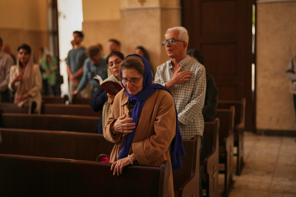Worshippers attend Easter Sunday Mass at Saint Sarkis Cathedral, an Armenian Apostolic church, in Tehran, Iran, Sunday, April 5, 2026. (AP Photo/Francisco Seco)