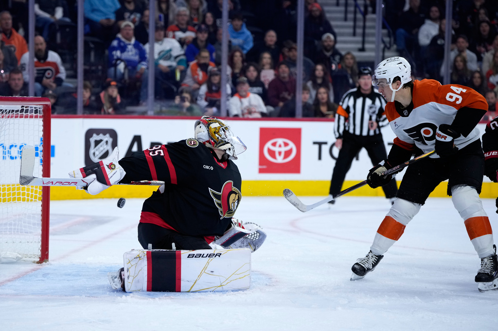 Philadelphia Flyers' Porter Martone, right, scores a goal against Ottawa Senators' Linus Ullmark during the second period of an NHL hockey game Saturday, Oct. 17, 2026, in Philadelphia. (AP Photo/Matt Slocum)