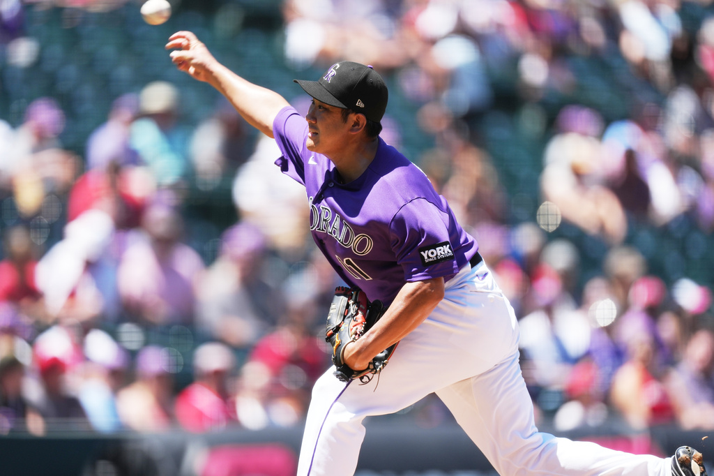 Colorado Rockies starting pitcher Tomoyuki Sugano works against the Cincinnati Reds in the first inning of a baseball game in Denver, Saturday, July 18, 2026. (AP Photo/David Zalubowski)