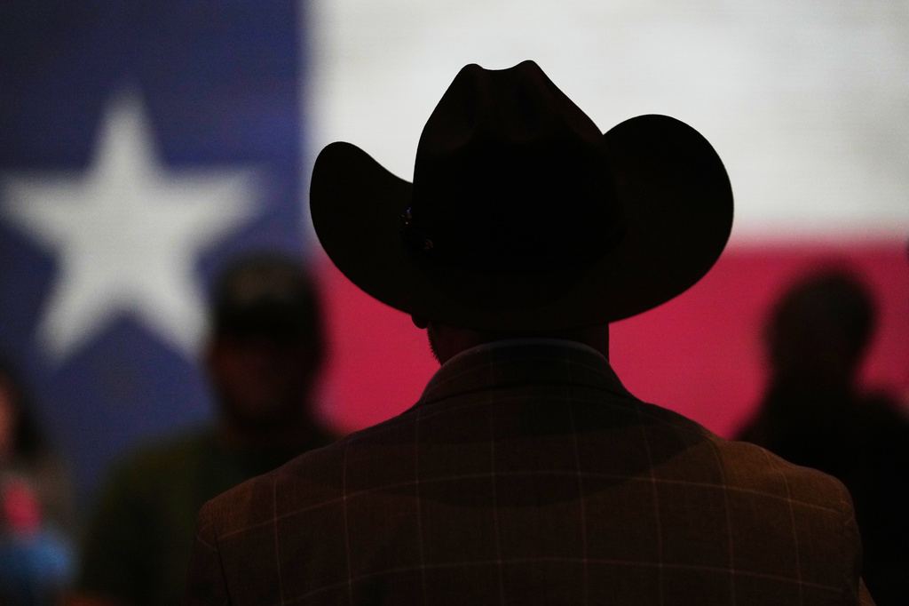 FILE - A cowboy hat and state flag are seen at a campaign event, Feb. 16, 2026, in Tyler, Texas. (AP Photo/Julio Cortez)