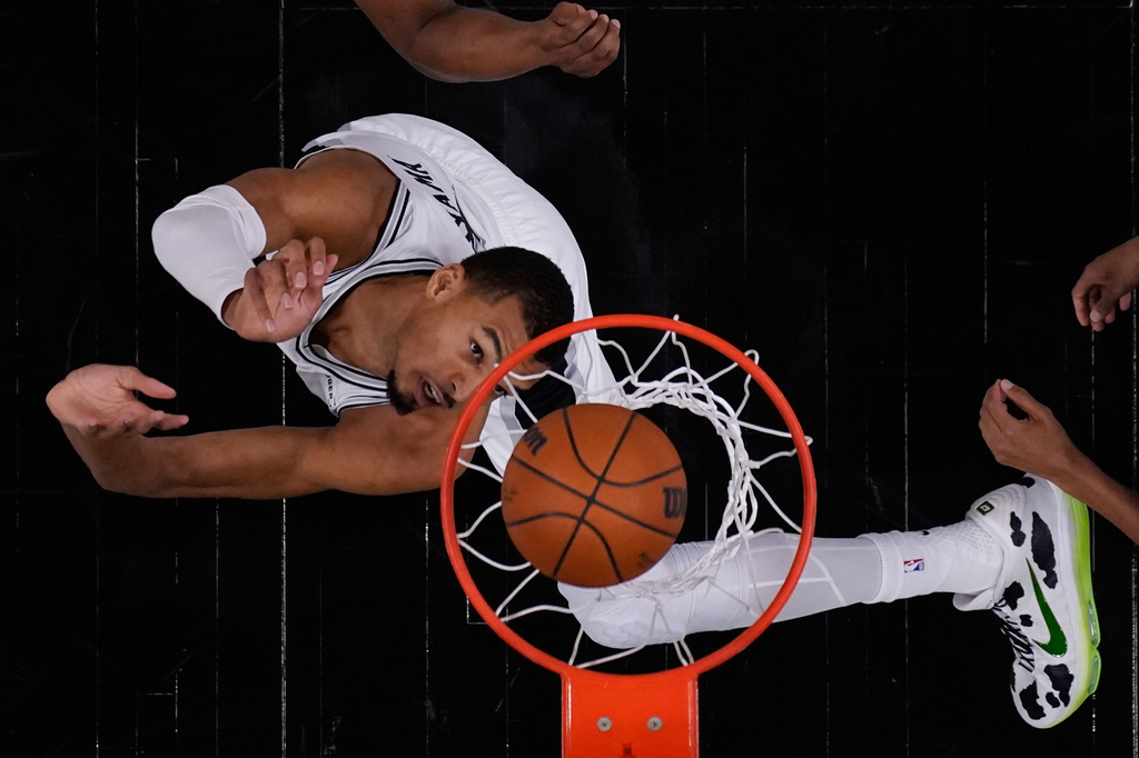 San Antonio Spurs forward Victor Wembanyama (1) scores against the Oklahoma City Thunder during the first half in Game 4 in the Western Conference finals NBA basketball playoffs series in San Antonio, Sunday, May 24, 2026. (AP Photo/Eric Gay)