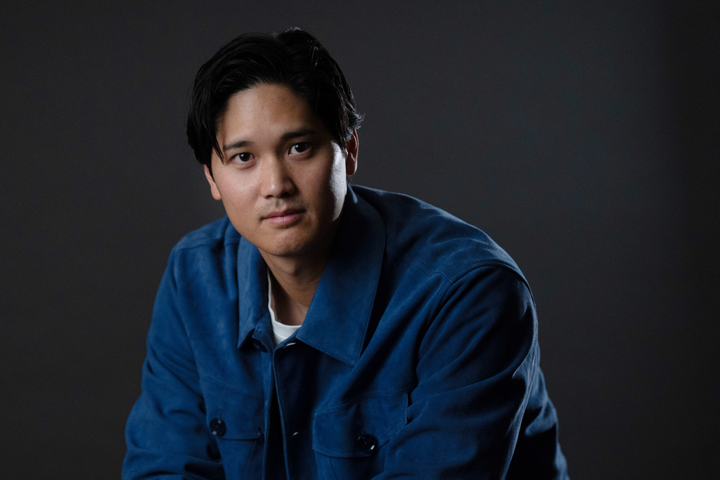 Los Angeles Dodgers' Shohei Ohtani poses for photos after an interview with The Associated Press in Pasadena, Calif., Wednesday, Nov. 26, 2025. (AP Photo/Jae C. Hong)