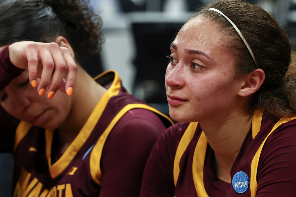 Minnesota guard Amaya Battle, right, reacts after a game against UCLA in the Sweet 16 of the NCAA college basketball tournament Friday, March 27, 2026, in Sacramento, Calif. (AP Photo/Sara Nevis)