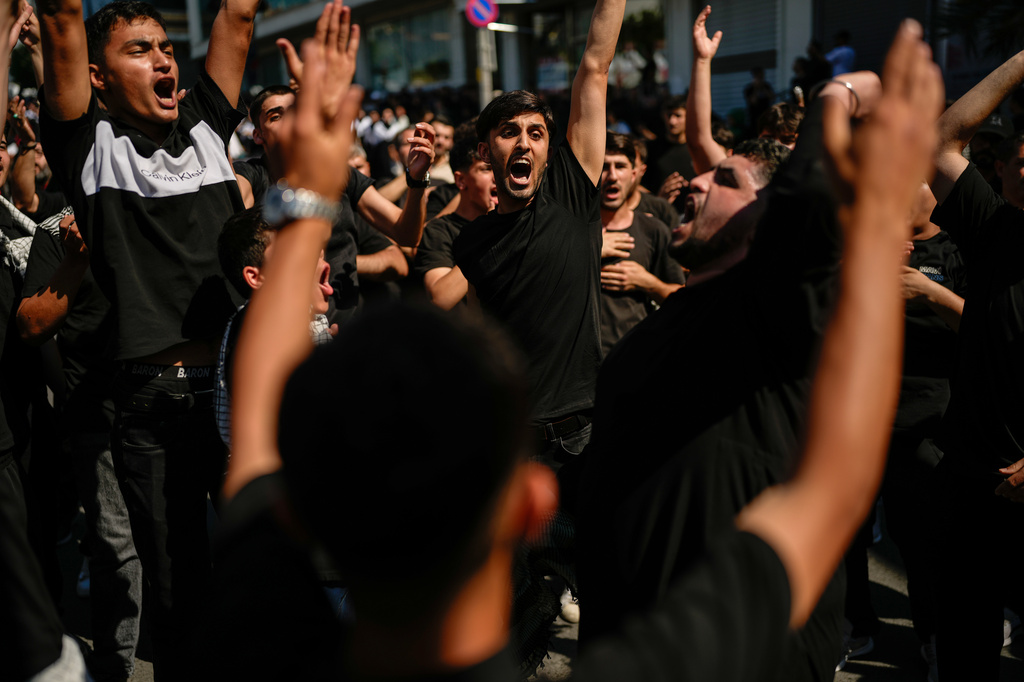 Shiite faithful Muslims attend an Ashoura procession which commemorates the 7th-century martyrdom of Imam Hussein in Istanbul, Turkey, Thursday, June 25, 2026. (AP Photo/Emrah Gurel)