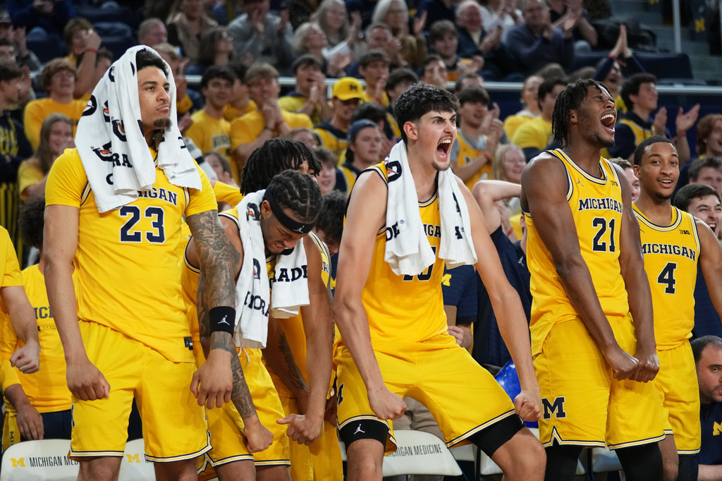 FILE - From left to right, Michigan forward Yaxel Lendeborg, guard Roddy Gayle Jr., center Aday Mara, forward Morez Johnson Jr. and guard Nimari Burnett react on the bench during the second half of an NCAA college basketball game against Villanova, Dec. 9, 2025, in Ann Arbor, Mich. (AP Photo/Ryan Sun, File)