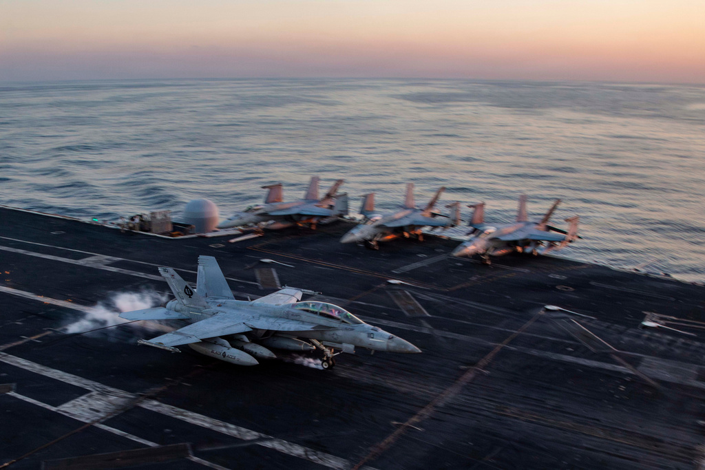 This image provided by U.S. Central Command shows a F/A-18F Super Hornet preparing to make an arrested landing on the USS Abraham Lincoln (CVN 72)) in support of Operation Epic Fury, on Saturday, Feb. 28, 2026. (U.S. Navy via AP)