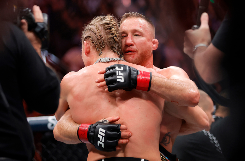 Paddy Pimblett, left, and Justin Gaethje embrace after Gaethje defeated Pimblett in an interim lightweight title fight during the UFC 324 mixed martial arts event Saturday Jan. 24, 2026, in Las Vegas. (AP Photo/Steve Marcus)