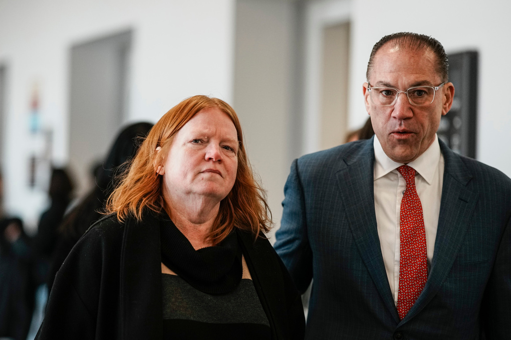 Asa Ellerup, left, wife, of Rex Heuermann and Ellerup's attorney, Robert Macedonio, right, walk to the courtroom as Rex Heuermann, accused in Long Island's infamous Gilgo Beach serial killings, is expected to plead guilty, Wednesday, April 8, 2026, at Suffolk County Court in Riverhead, N.Y. (AP Photo/Eduardo Munoz Alvarez)