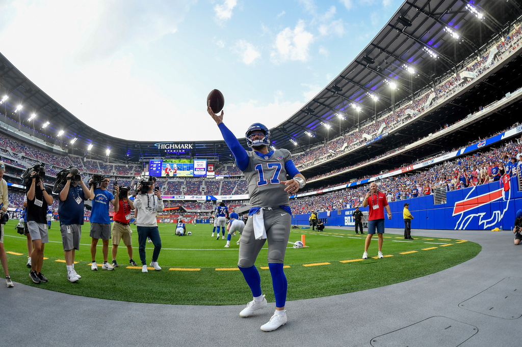 Buffalo Bills quarterback Josh Allen (17) plays catch with fans during practice at the team's NFL football training camp Saturday, Aug. 8, 2026, in Orchard Park, N.Y. (AP Photo/Adrian Kraus)