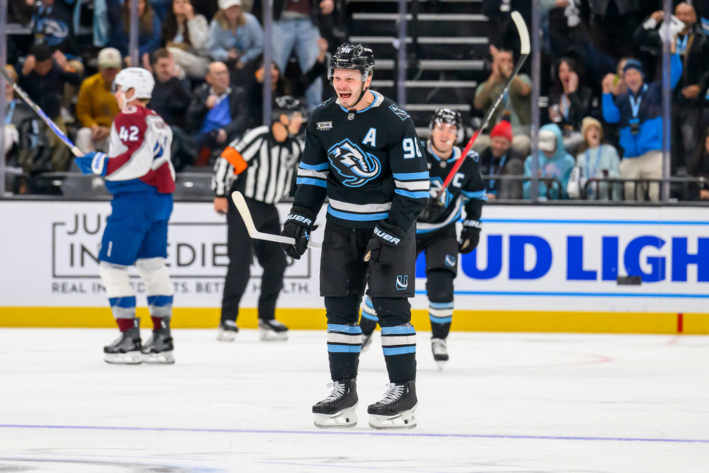 Utah Mammoth defenseman Mikhail Sergachev (98) yells in celebration after scoring a goal during the third period of an NHL hockey game against the Colorado Avalanche, Tuesday, Oct. 21, 2025, in Salt Lake City, Utah. (AP Photo/Tyler Tate)