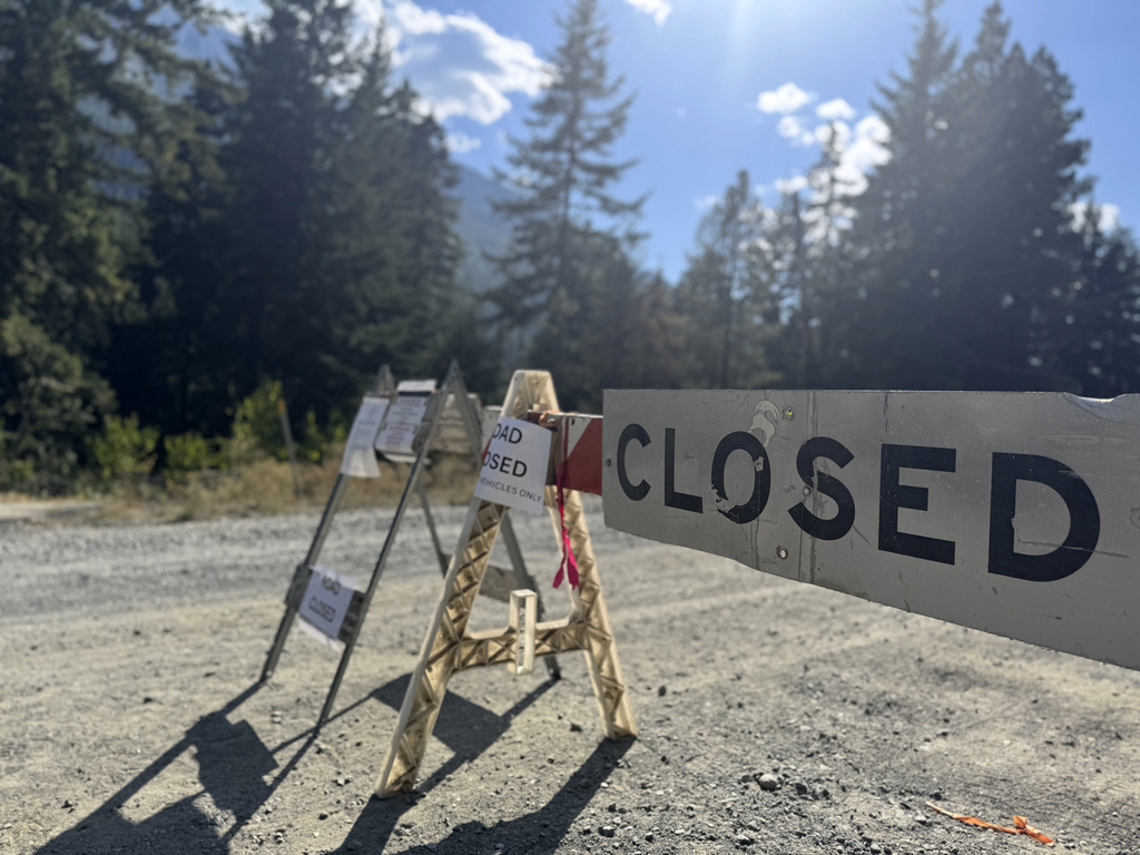This photo provided by FBI Seattle shows a closed road to Rock Island Campground where multiple law enforcement agencies are participating in the search for Travis Decker, who was charged with murder and kidnapping, near Leavenworth, Wa. on Monday, August. 25, 2025. (FBI via AP)
