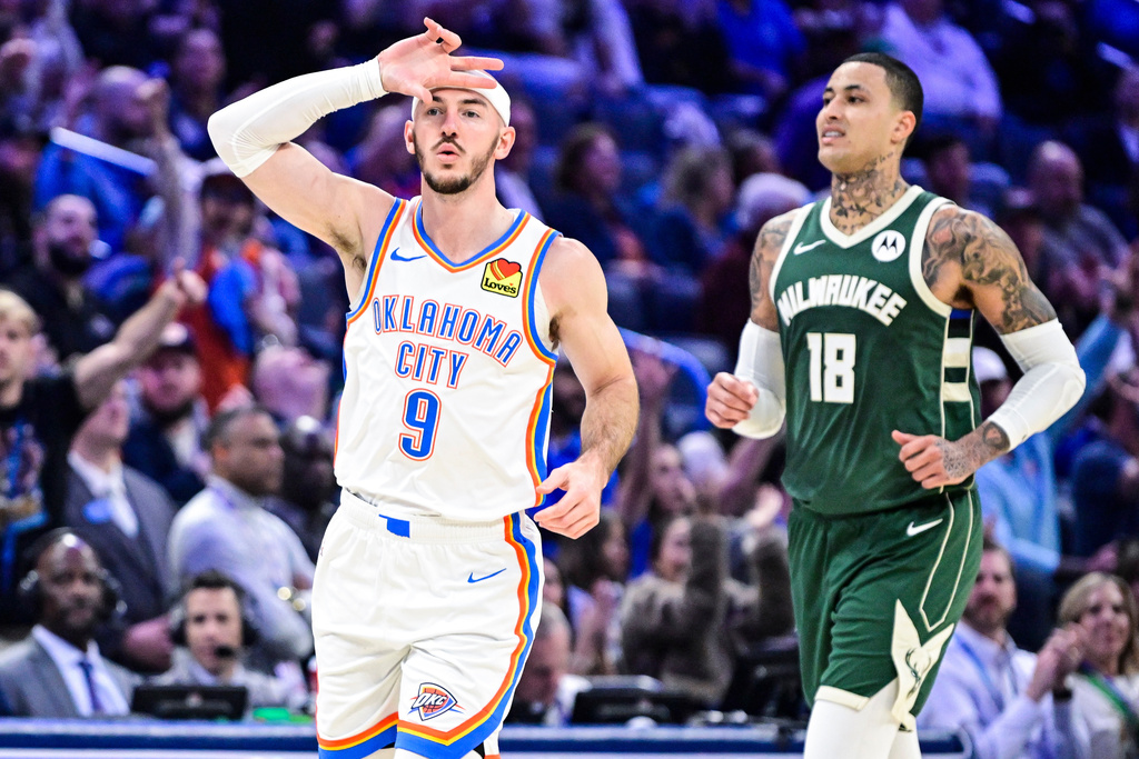 Oklahoma City Thunder guard Alex Caruso (9) celebrates against the Milwaukee Bucks during the first half of an NBA basketball game, Thursday, Feb. 12, 2026, in Oklahoma City. (AP Photo/Gerald Leong)