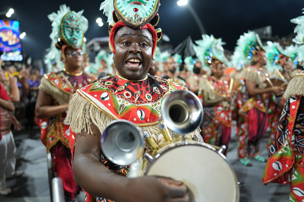 Drummers from the Mocidade Unida da Mooca samba school perform during a carnival parade in Sao Paulo, Friday, Feb. 13, 2026. (AP Photo/Andre Penner)