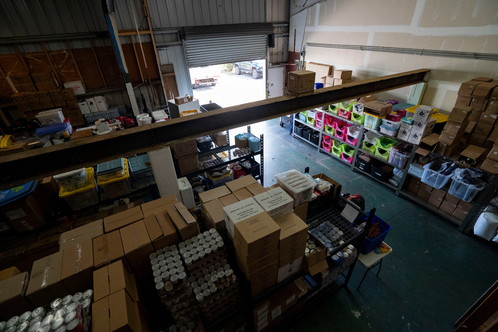 Supplies are stored inside the warehouse of Maui Rapid Response, a nonprofit supporting Maui fire survivors with cash assistance, in Kahului, Hawaii, Wednesday, March 4, 2026. (AP Photo/Mengshin Lin)