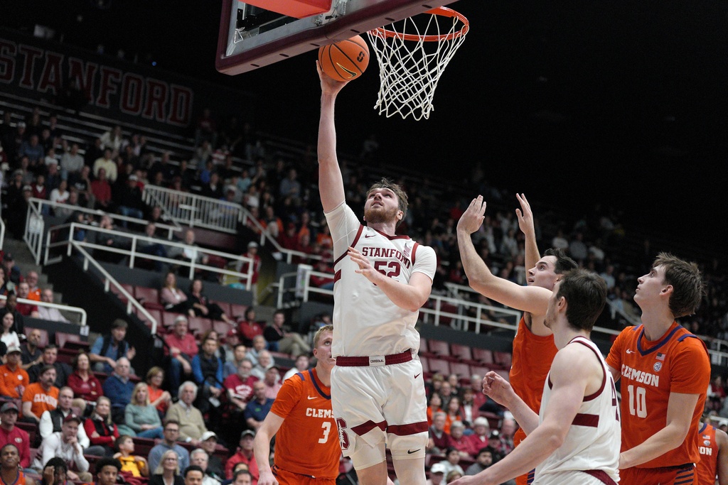 Stanford forward Aidan Cammann (52) drives to the basket against Clemson forward Chase Thompson during the first half of an NCAA college basketball game in Stanford, Calif., Wednesday, Feb. 4, 2026. (AP Photo/Tony Avelar)