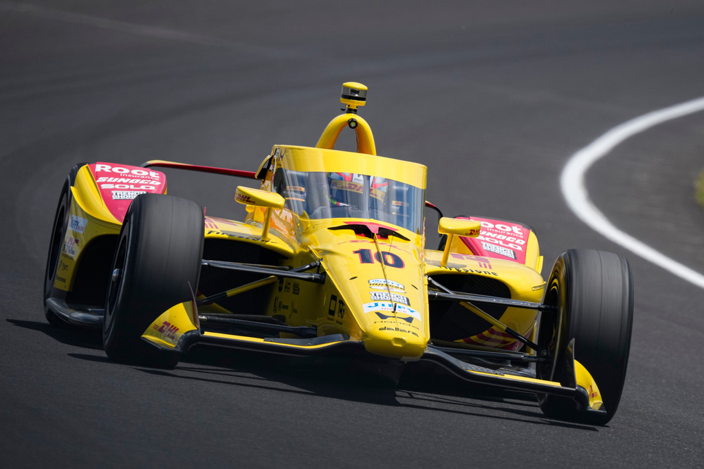 Alex Palou, of Spain, drives through the third turn during qualifications for the Indianapolis 500 auto race at the Indianapolis Motor Speedway in Indianapolis, Sunday, May 17, 2026. (AP Photo/Michael Conroy)