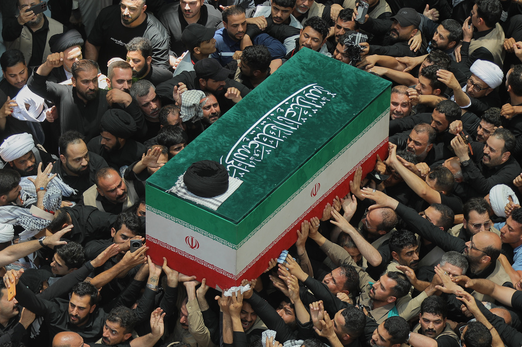 The coffin of the late Iranian Supreme Leader Ayatollah Ali Khamenei is carried by mourners to the Imam Ali Shrine in Najaf, Iraq, Wednesday, July 8, 2026. (AP Photo/Anmar Khalil)