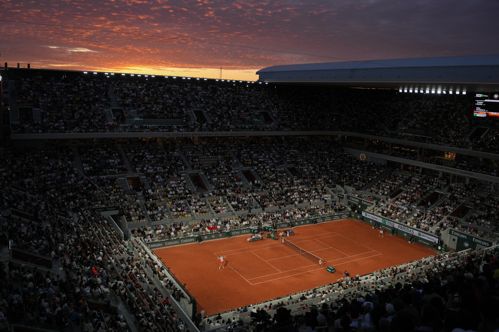 Fans watch the fourth-round tennis match between pcasp and Brazil's Joao Fonseca at the French Open in Paris, Sunday, May 31, 2026. (AP Photo/Thibault Camus)