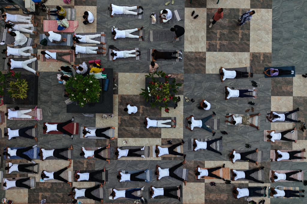 People perform yoga during an event to mark International Yoga Day along the river Brahmaputra in Guwahati, India, Sunday, June 21, 2026. (AP Photo/Anupam Nath)