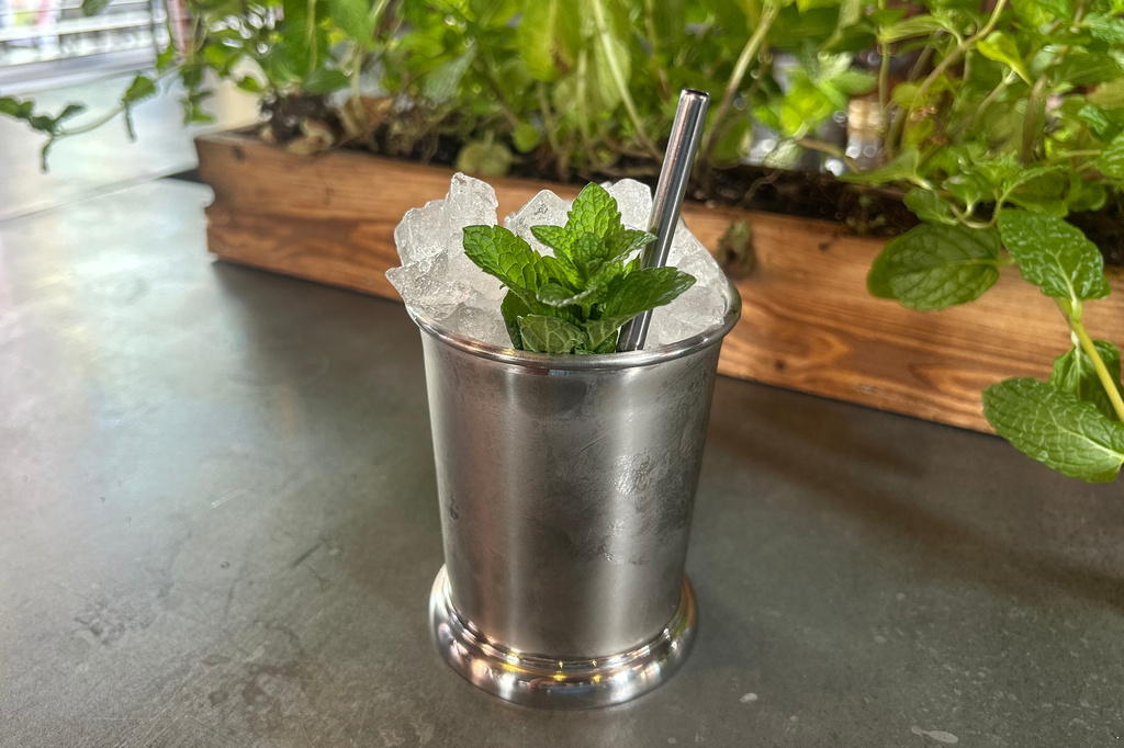 A Mint Julep cocktail is displayed at the cocktail bar Cato in London on April 22, 2026. (AP Photo/Louise Dixon)