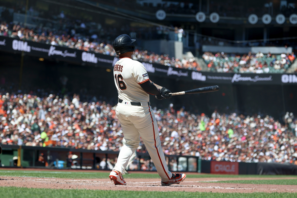 San Francisco Giants' Rafael Devers watches his grand slam during the fifth inning of a baseball game against the Chicago White Sox in San Francisco, Sunday, May 24, 2026. (AP Photo/Jed Jacobsohn)