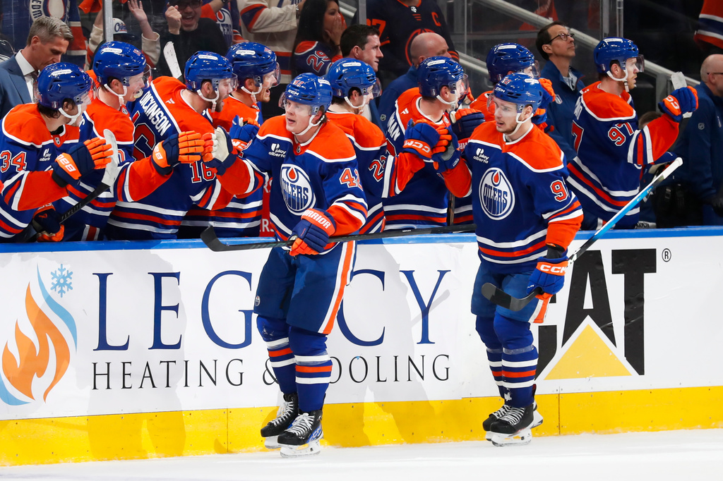 Edmonton Oilers' Kasperi Kapanen (42) celebrates the game-winning goal against the Anaheim Ducks during the third period of an NHL playoff game in Edmonton on Monday, April 20, 2026. (Codie McLachlan/The Canadian Press via AP)