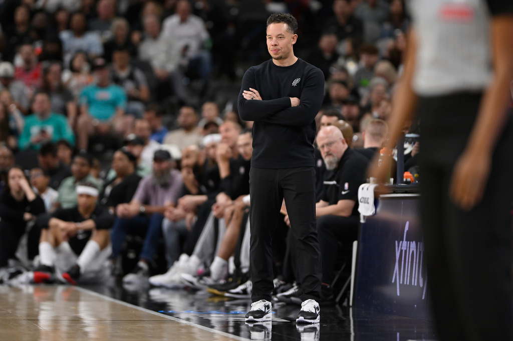 San Antonio Spurs head coach Mitch Johnson watches the play during the first half of an NBA basketball game against the Chicago Bulls, Monday, March 30, 2026, in San Antonio. (AP Photo/Darren Abate)