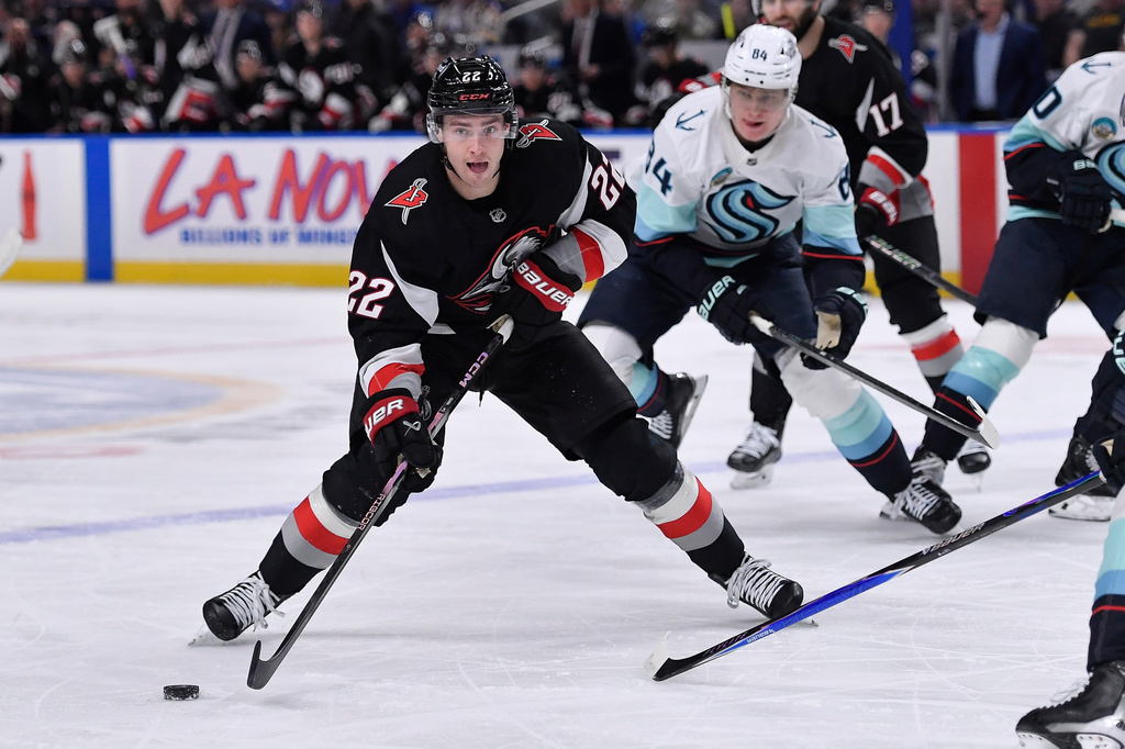 Buffalo Sabres right wing Jack Quinn (22) skates with the puck during the first period of an NHL hockey game against the Seattle Kraken, Saturday, March 28, 2026, in Buffalo, N.Y. (AP Photo/Adrian Kraus)