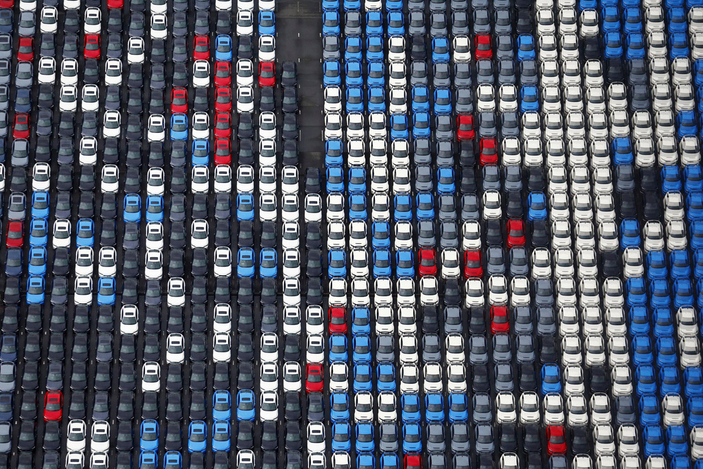 Vehicles are parked for export at a Yokohama port, near Tokyo on Aug. 1, 2025. (Takuto Kaneko/Kyodo News via AP)