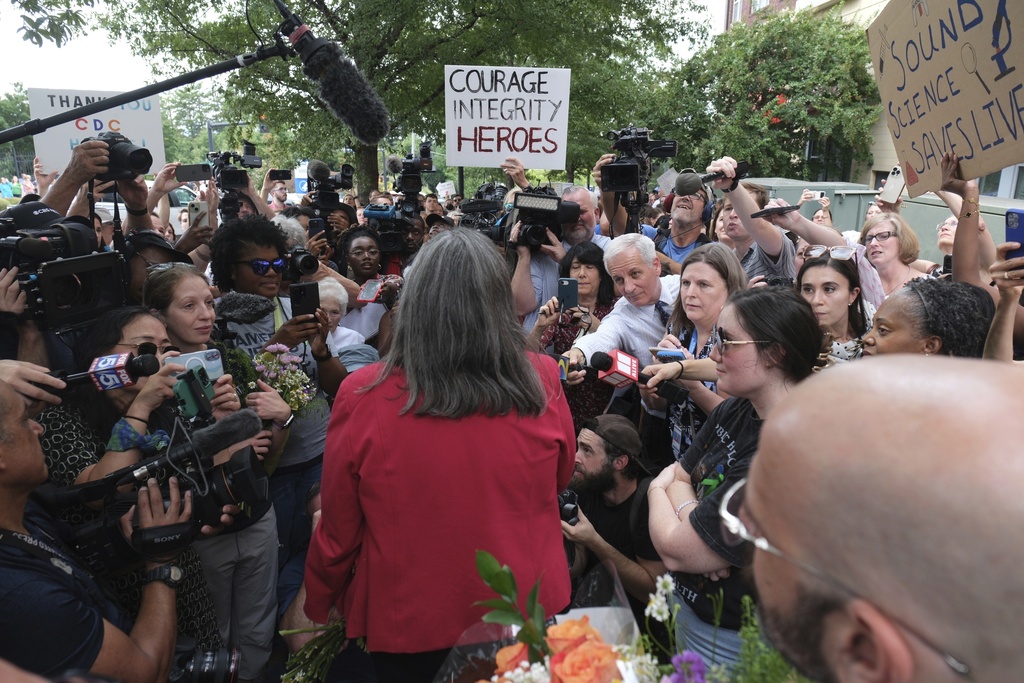 Dr. Debra Houry talks to workers and supporters as they rally for departing scientific leaders at the Centers for Disease Control and Prevention outside the CDC headquarters, Thursday, Aug. 28, 2025, in Atlanta. (AP Photo/Ben Gray)