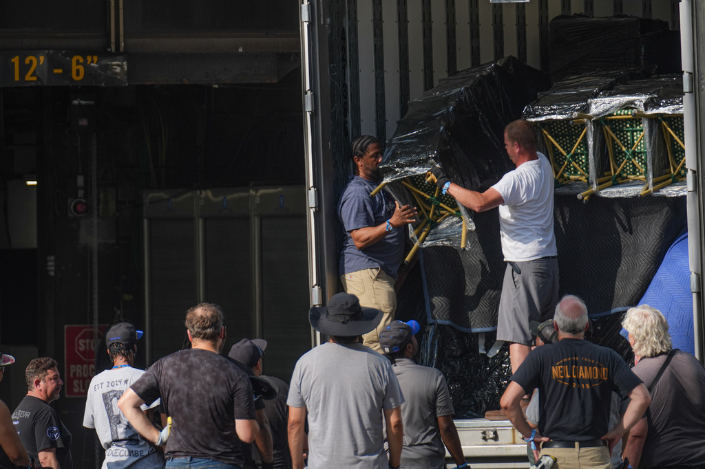 A work crew unloads chairs from a truck outside of Madison Square Garden ahead of a reported wedding between singer Taylor Swift and National Football League player Travis Kelce on Thursday, July 2, 2026, in New York. (AP Photo/Ryan Murphy)