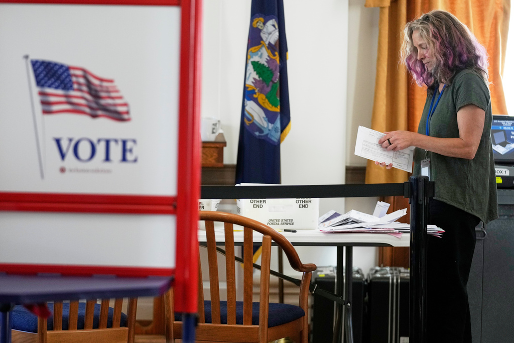 An election official sorts ballots during early voting, Tuesday, Oct. 28, 2025, in Portland, Maine. (AP Photo/Robert F. Bukaty)