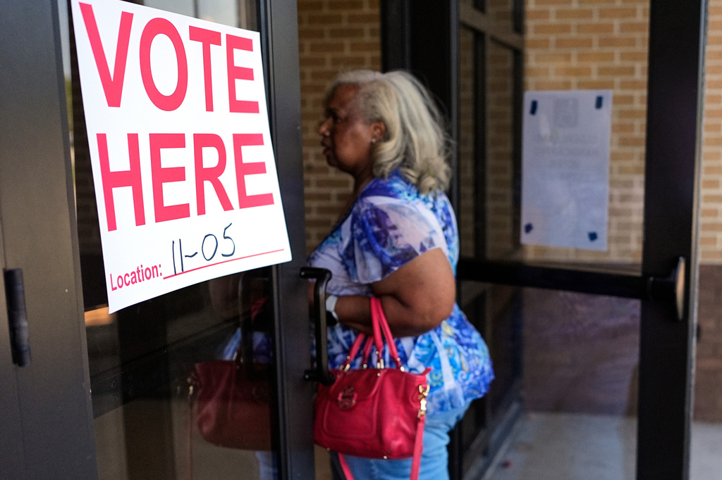 Helen Plummer walks into a polling place to cast her ballot in a primary election Thursday, Aug. 6, 2026, in Memphis, Tenn. (AP Photo/George Walker IV)