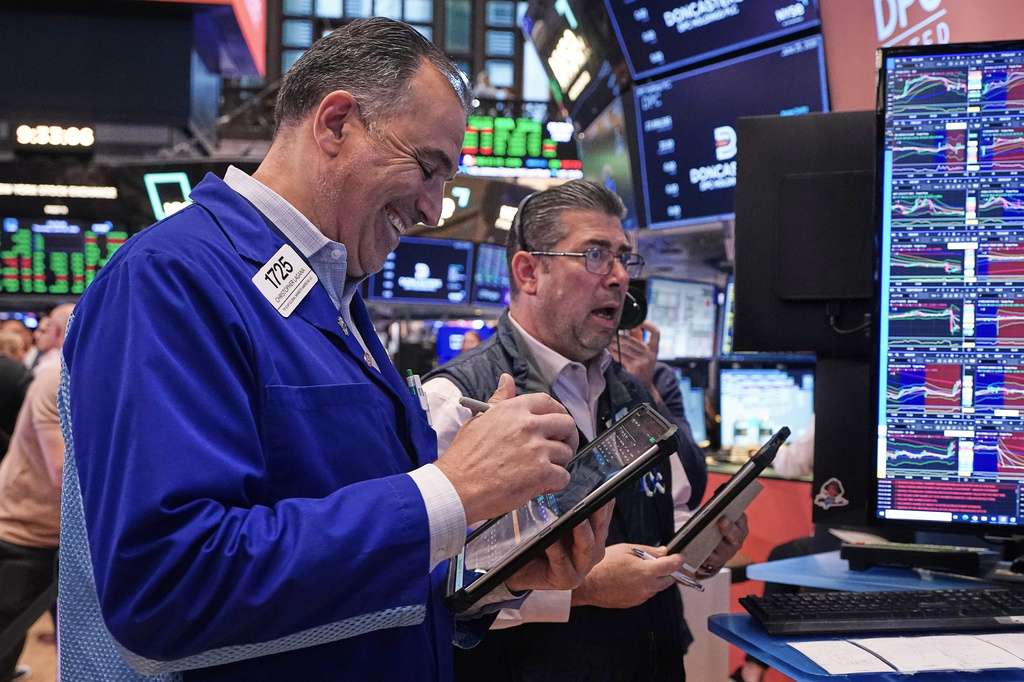 Traders Chris Lagana, left, and Michael Capolino work on the floor of the New York Stock Exchange, Thursday, June 25, 2026. (AP Photo/Richard Drew)