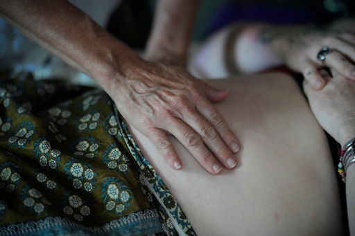FILE - A pregnant patient is examined Aug. 31, 2023, in Summertown, Tenn. (AP Photo/George Walker IV, File) FILE - A pregnant patient is examined Aug. 31, 2023, in Summertown, Tenn. (AP Photo/George Walker IV, File)