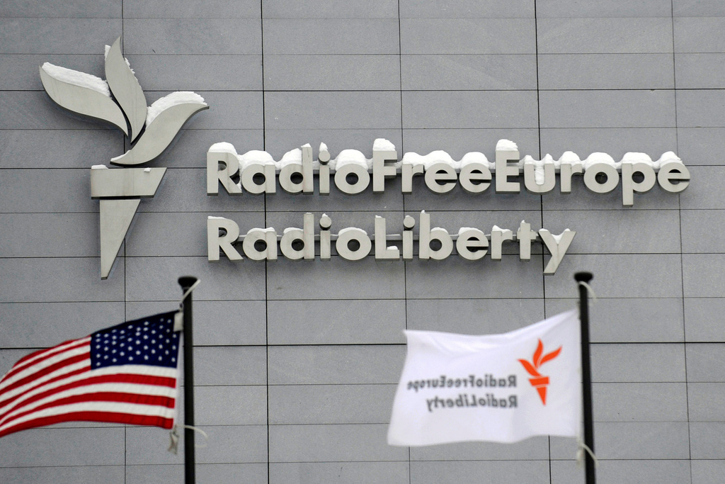 FILE - The headquarters of Radio Free Europe/Radio Liberty (RFE/RL) is seen with the American flag in the foreground, in Prague, Jan. 15, 2010. (Michal Kamaryt/CTK via AP, file)