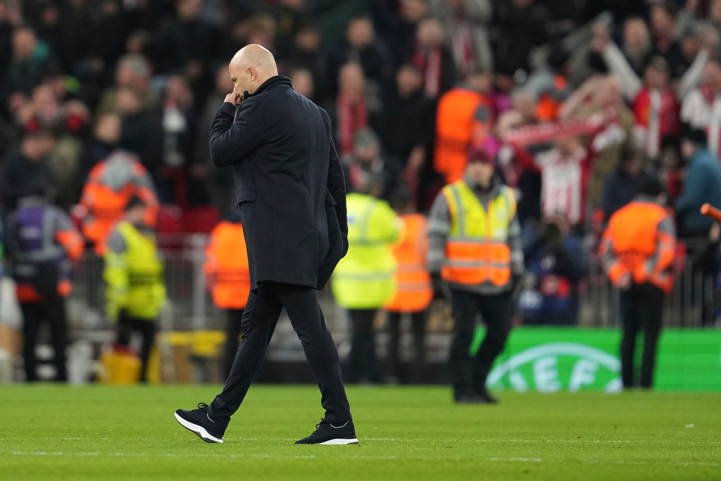 Liverpool's manager Arne Slot leaves the pitch after the Champions League opening phase soccer match between Liverpool and PSV in Liverpool, England, Wednesday, Nov. 26, 2025. (AP Photo/Jon Super)