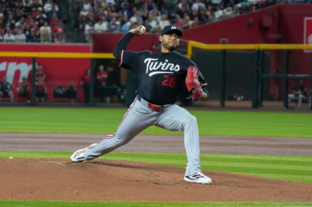 Minnesota Twins pitcher Taj Bradley works against the Arizona Diamondbacks during the first inning of a baseball game Saturday, June 20, 2026, in Phoenix. (AP Photo/Darryl Webb)
