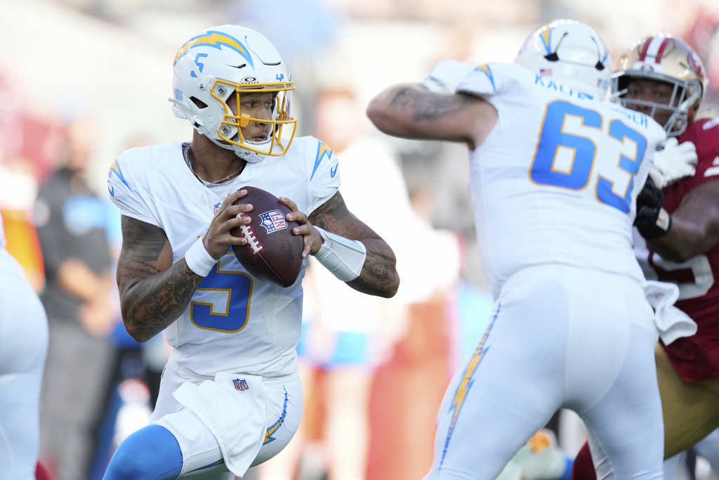 Los Angeles Chargers quarterback Trey Lance (5) drops back to pass against the San Francisco 49ers during the first half of an NFL preseason football game in Santa Clara, Calif., Saturday, Aug. 23, 2025. (AP Photo/Godofredo A. Vásquez)