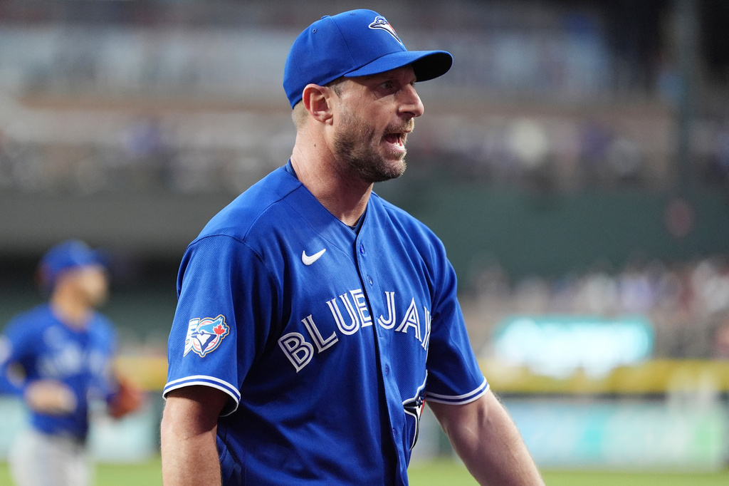 Toronto Blue Jays starting pitcher Max Scherzer shouts as he walks off the field during the sixth inning of a baseball game against the Arizona Diamondbacks, Saturday, April 18, 2026, in Phoenix. (AP Photo/Ross D. Franklin)