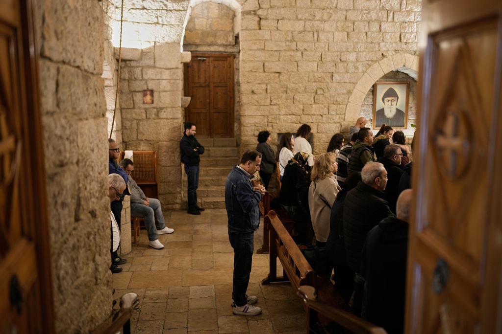 Pilgrims attend Mass in the church inside St. Charbel's monastery in the northern village of Annaya, Lebanon, Saturday, Nov. 15, 2025. (AP Photo/Hassan Ammar)