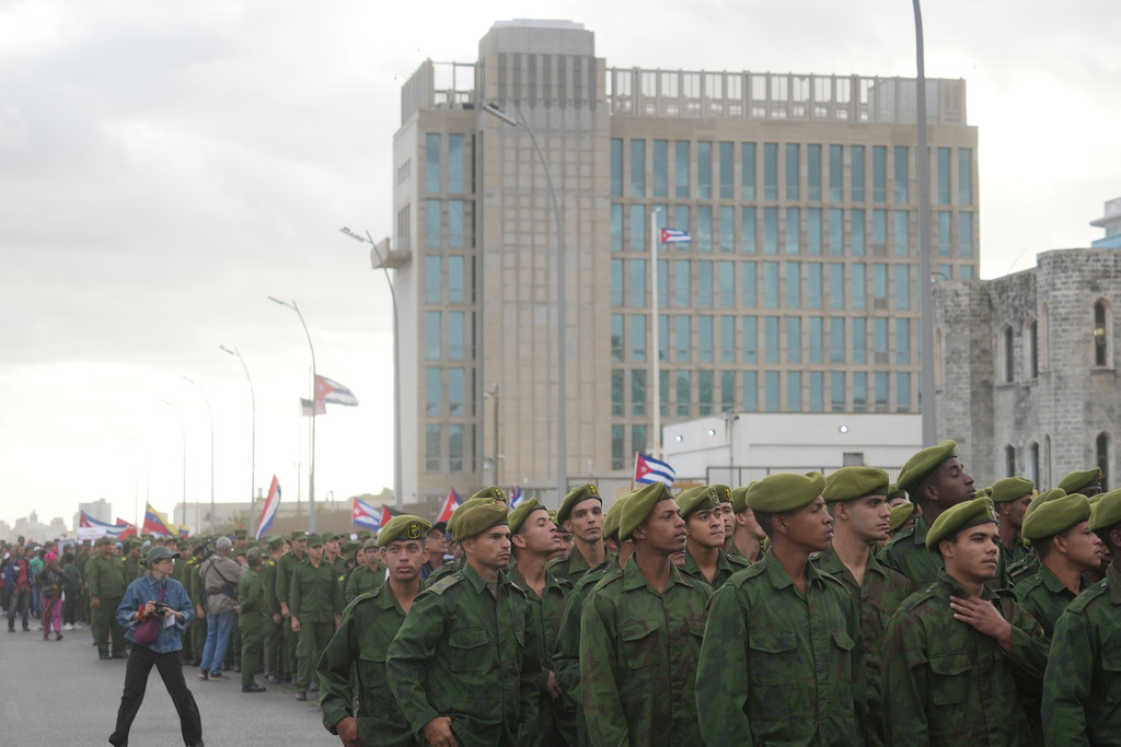 Soldiers march outside the U.S. Embassy during a rally to protest the killing of Cuban officers during the U.S. operation in Venezuela that captured Venezuelan President Nicolas Maduro in Havana, Cuba, Friday, Jan. 16, 2026. (AP Photo/Ramon Espinosa)