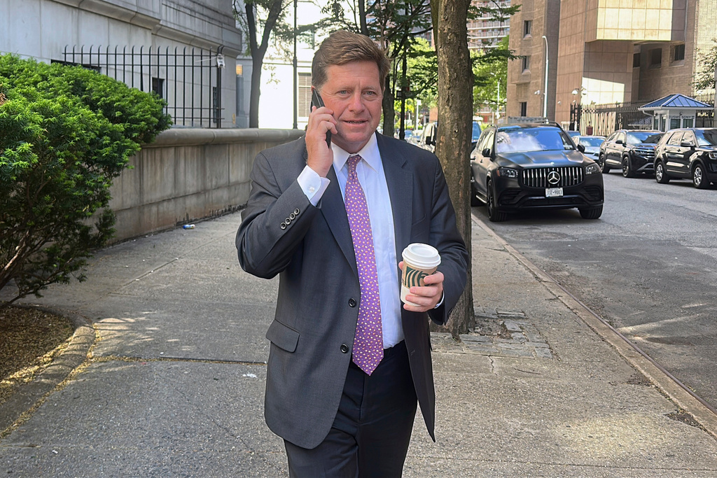 FILE - Acting U.S. Attorney for the Southern District of New York Jay Clayton talks on a phone as he exits court in New York, May 19, 2025. (AP Photo/Ted Shaffrey, File)