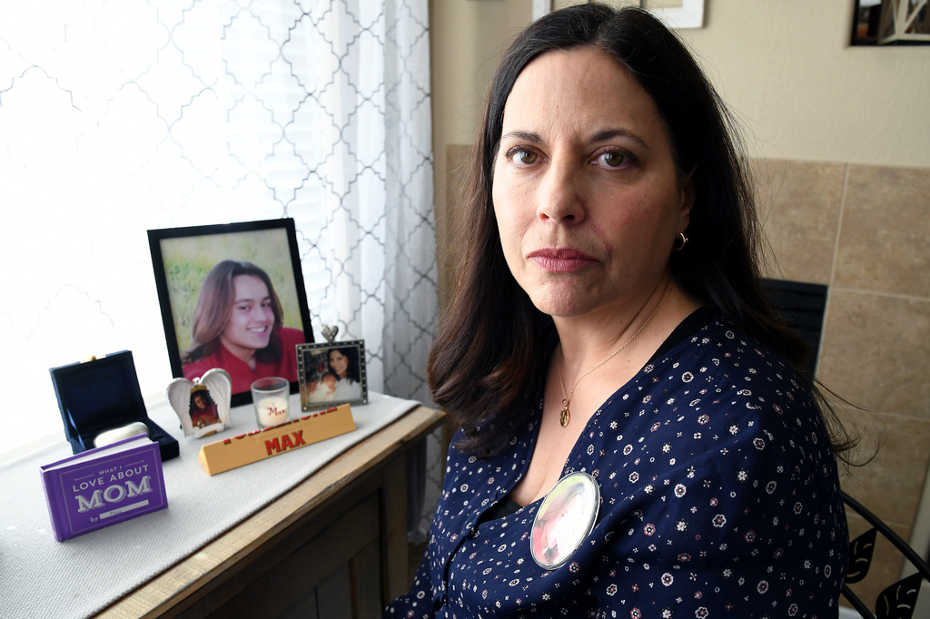 Kim Osterman, who says her son Max died after taking fentanyl he bought from a dealer on Snapchat, poses for a portrait in her living room in Thornton, Colo., Thursday, March 26, 2026. (AP Photo/Thomas Peipert)