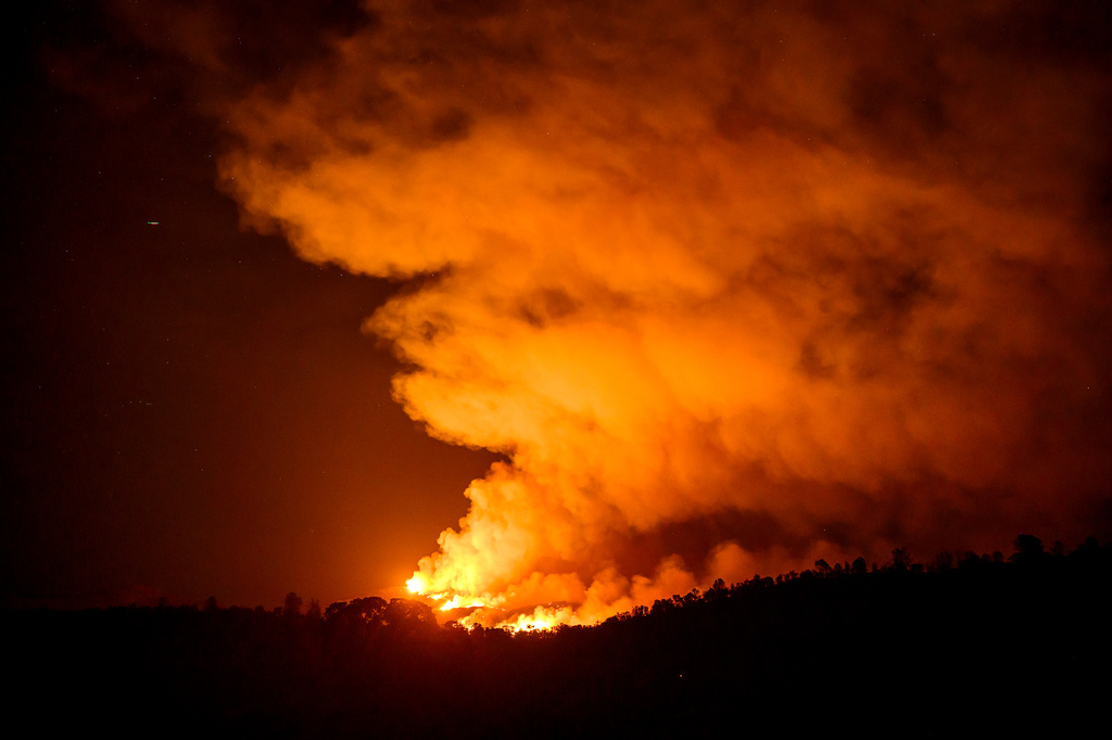 The Gann Fire burns along a hillside near Copperopolis on Tuesday, Aug. 4, 2026, in Calaveras County, Calif. (AP Photo/Noah Berger)