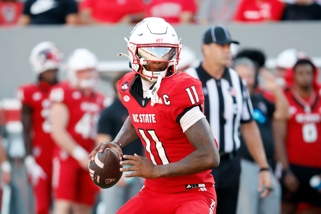 North Carolina State quarterback CJ Bailey (11) looks to throw the ball during the second half of an NCAA college football game against Campbell in Raleigh, N.C., Saturday, Oct. 4, 2025. (AP Photo/Karl DeBlaker)