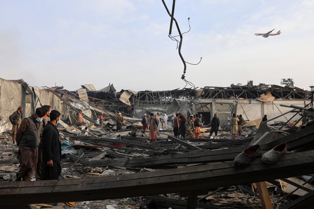Residents and volunteers inspect the site of a late-Monday airstrike at a drug rehabilitation hospital in Kabul, Afghanistan, Tuesday, March 17, 2026. (AP Photo/Siddiqullah Alizai)