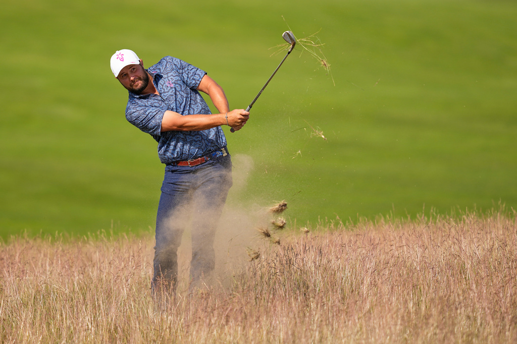 Peter Uihlein hits from the tall fescue on the 13th hole during the second round of the U.S. Open golf tournament at Shinnecock Hills Golf Club in Southampton, N.Y., Friday, June 19, 2026.(AP Photo/David J. Phillip)