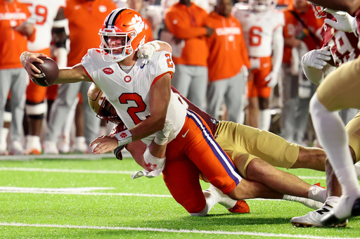 Clemson quarterback Cade Klubnik (2) reaches out for a first down during the first half of an NCAA college football game against Clemson, Saturday, Oct. 11, 2025 in Boston. (AP Photo/Mark Stockwell) Clemson quarterback Cade Klubnik (2) reaches out for a first down during the first half of an NCAA college football game against Clemson, Saturday, Oct. 11, 2025 in Boston. (AP Photo/Mark Stockwell)