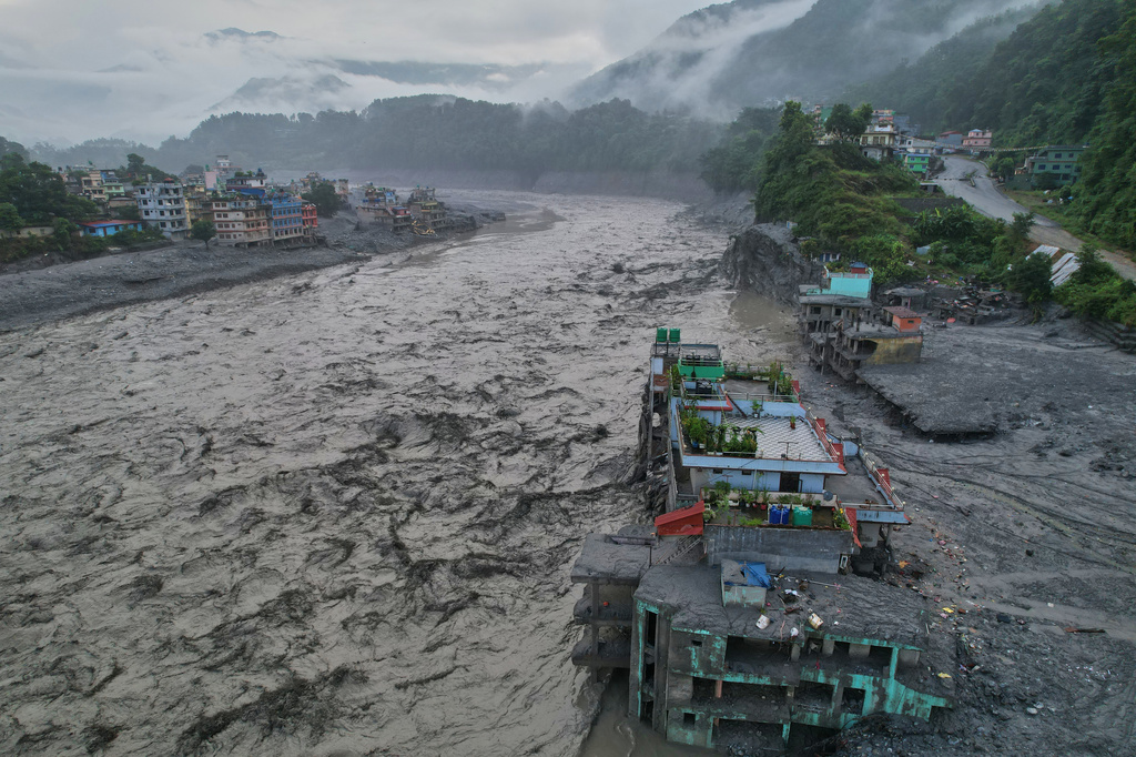 A drone view of the aftermath of flash flooding along the Trishuli river amidst fresh water surge warning in the Trishuli Bazaar area of Nuwakot district, Nepal, Sunday, Aug. 30, 2026. (AP Photo/Rajesh Kumar Singh)